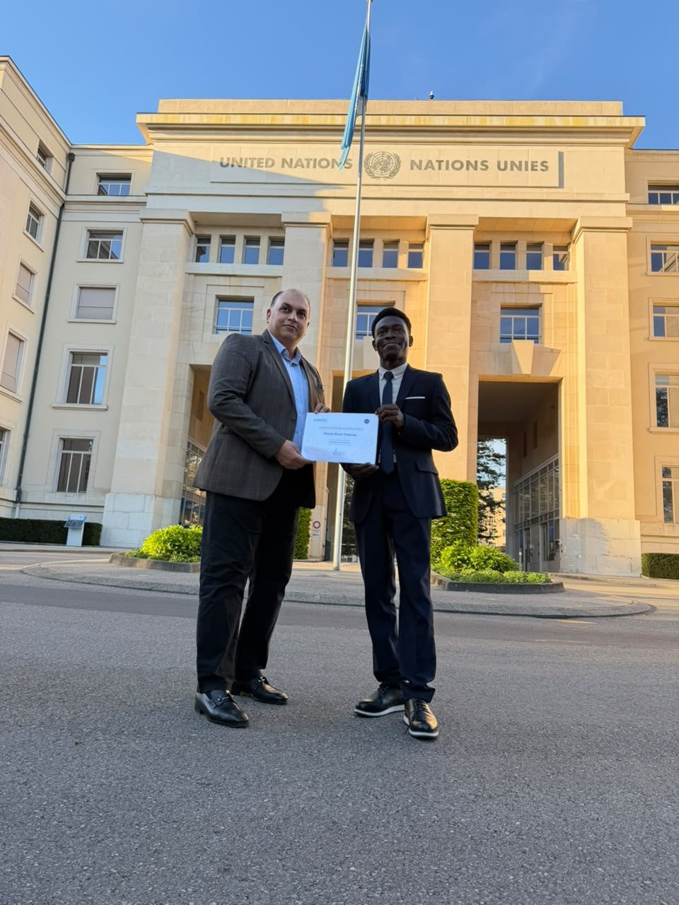 Koessi Kevin Zokpodo receiving a certificate in front of the Palais des Nations, United Nations Geneva